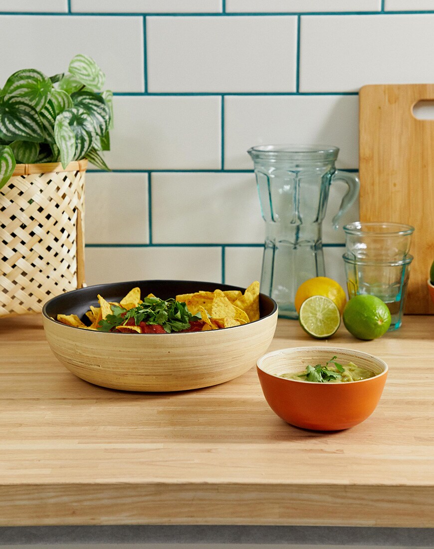 A set of two tonal bowls holding tasty nachos and guac by ASOS SUPPLY. available at ASOS.