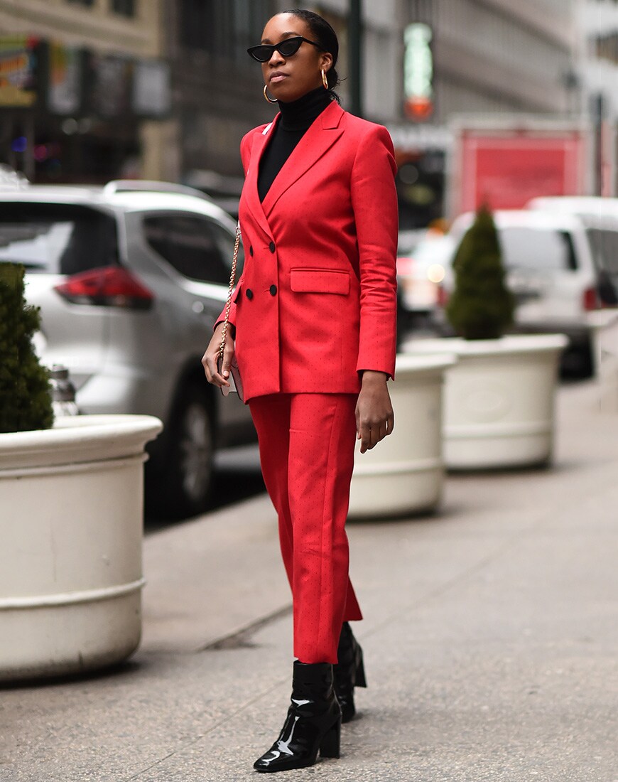 Street image of a Chrissy Rutherford in a red suit | ASOS Street Style