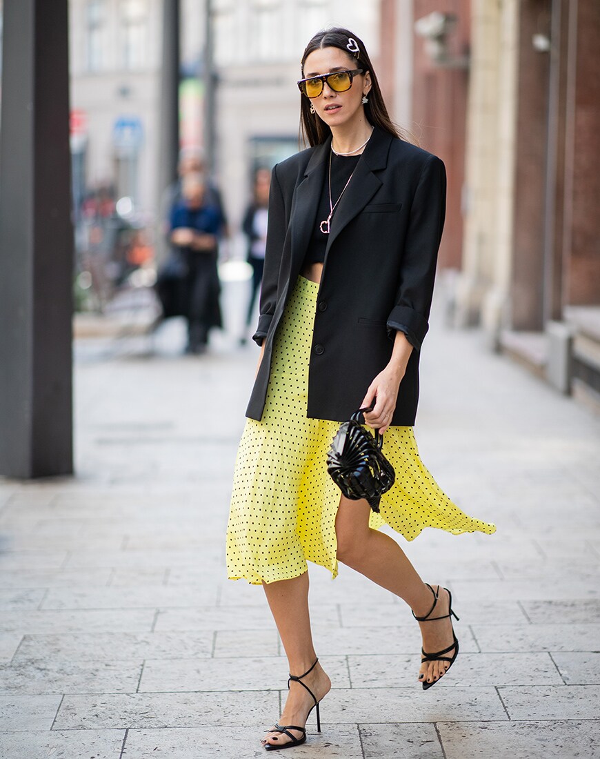A street style image of a woman in a polka dot skirt | ASOS Style Feed