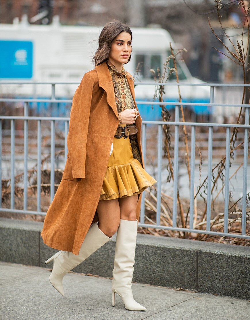 A street style image of a woman wearing a min skirt | ASOS Style Feed