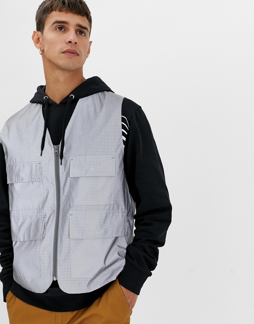 A picture of a model wearing a reflective gilet. Available at ASOS.