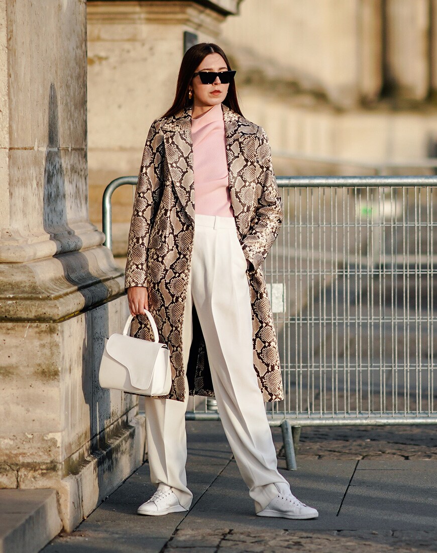 A street style image of a woman in a snake print coat | ASOS Style Feed