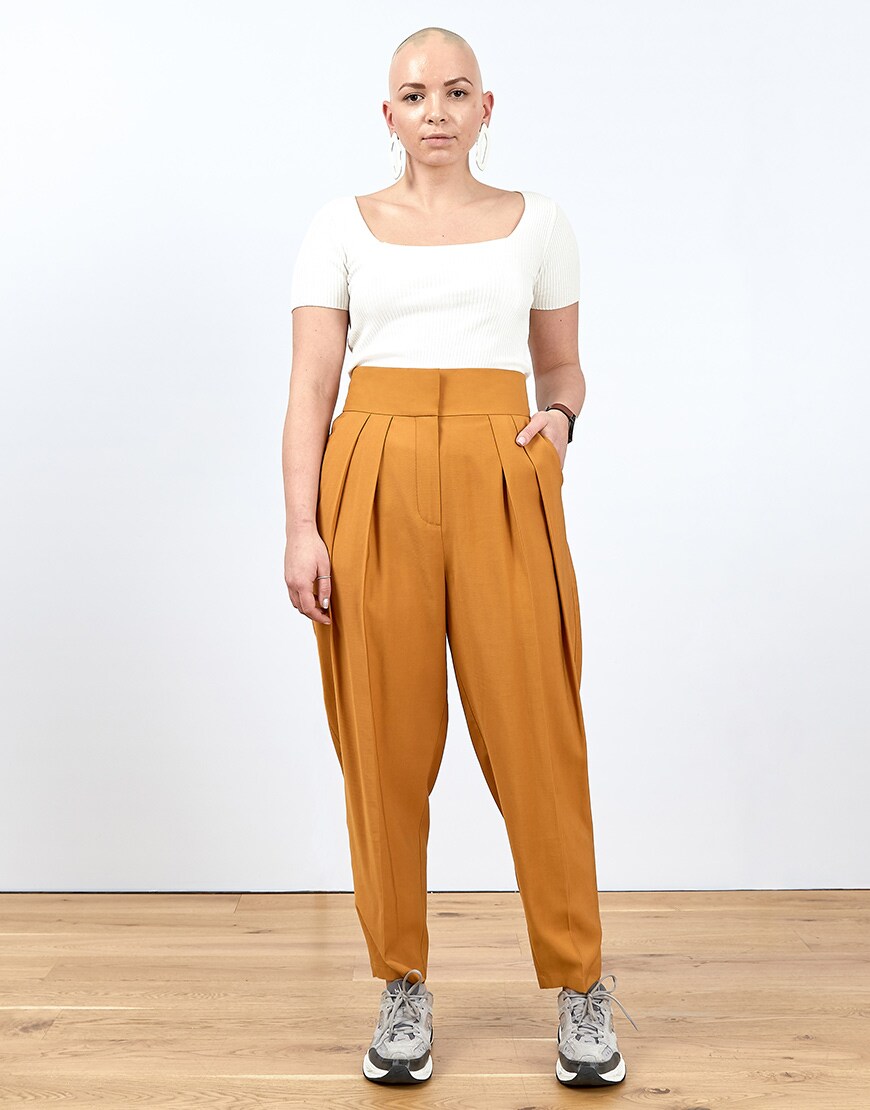 A picture of an ASOSer in a white top and brown trousers | ASOS Style Feed