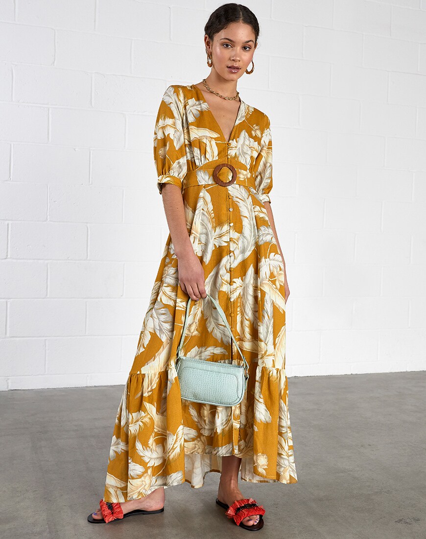 woman in tropical print dress