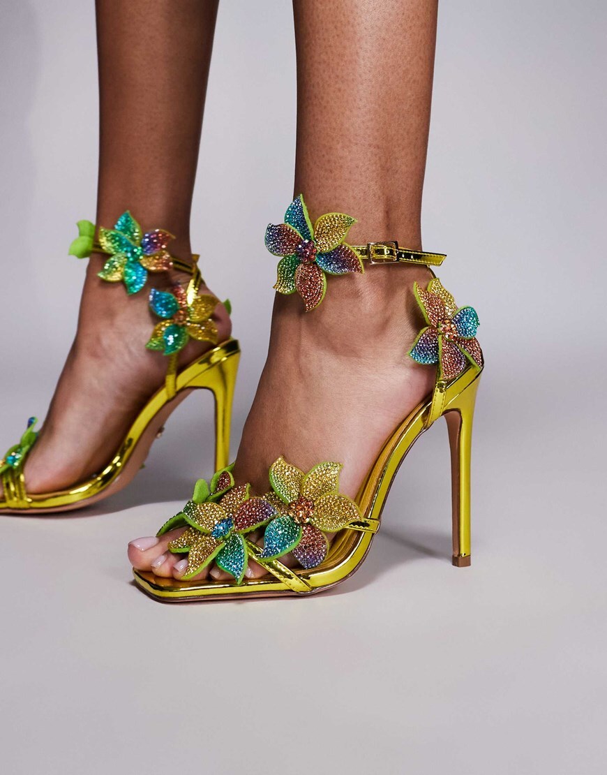 A model wearing blue and green strappy heels