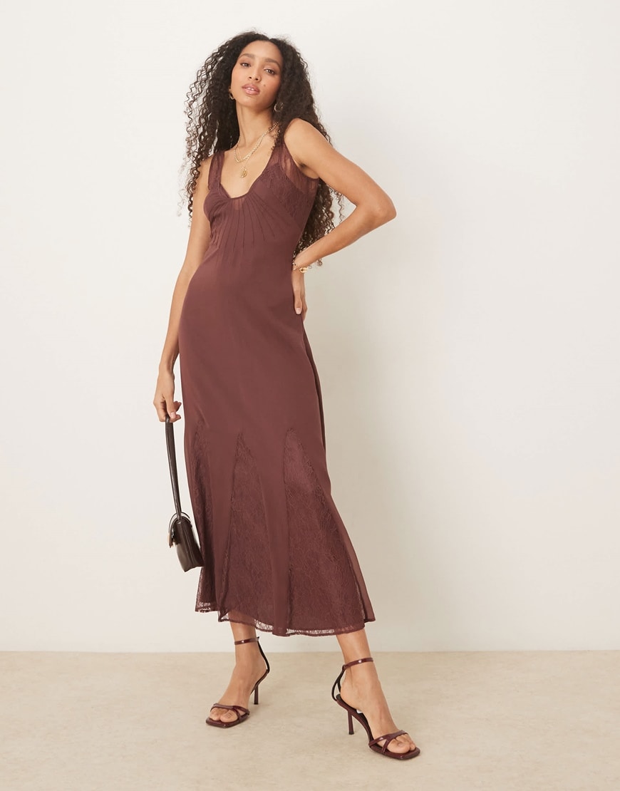 A model wearing a brown maxi dress