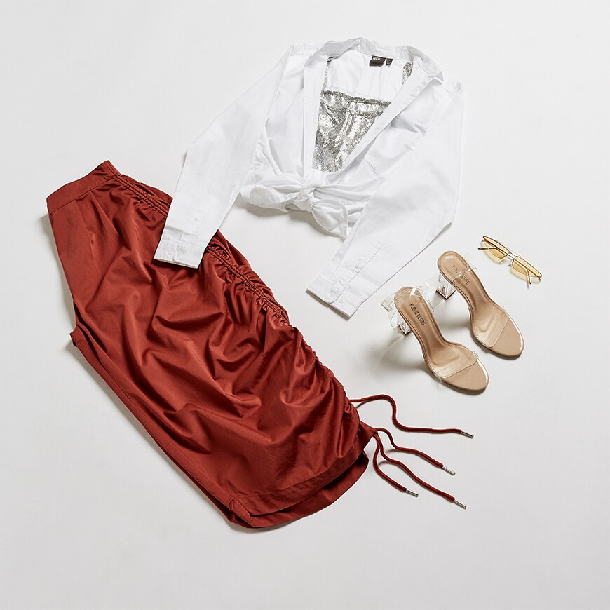 A flat lay of red skirt and white shirt | ASOS Style Feed