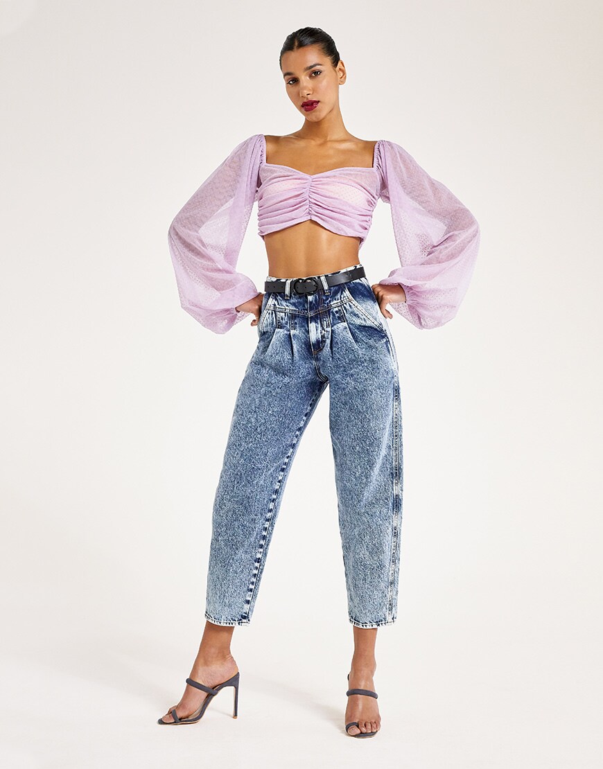 A model wearing a purple top and jeans | ASOS Style Feed