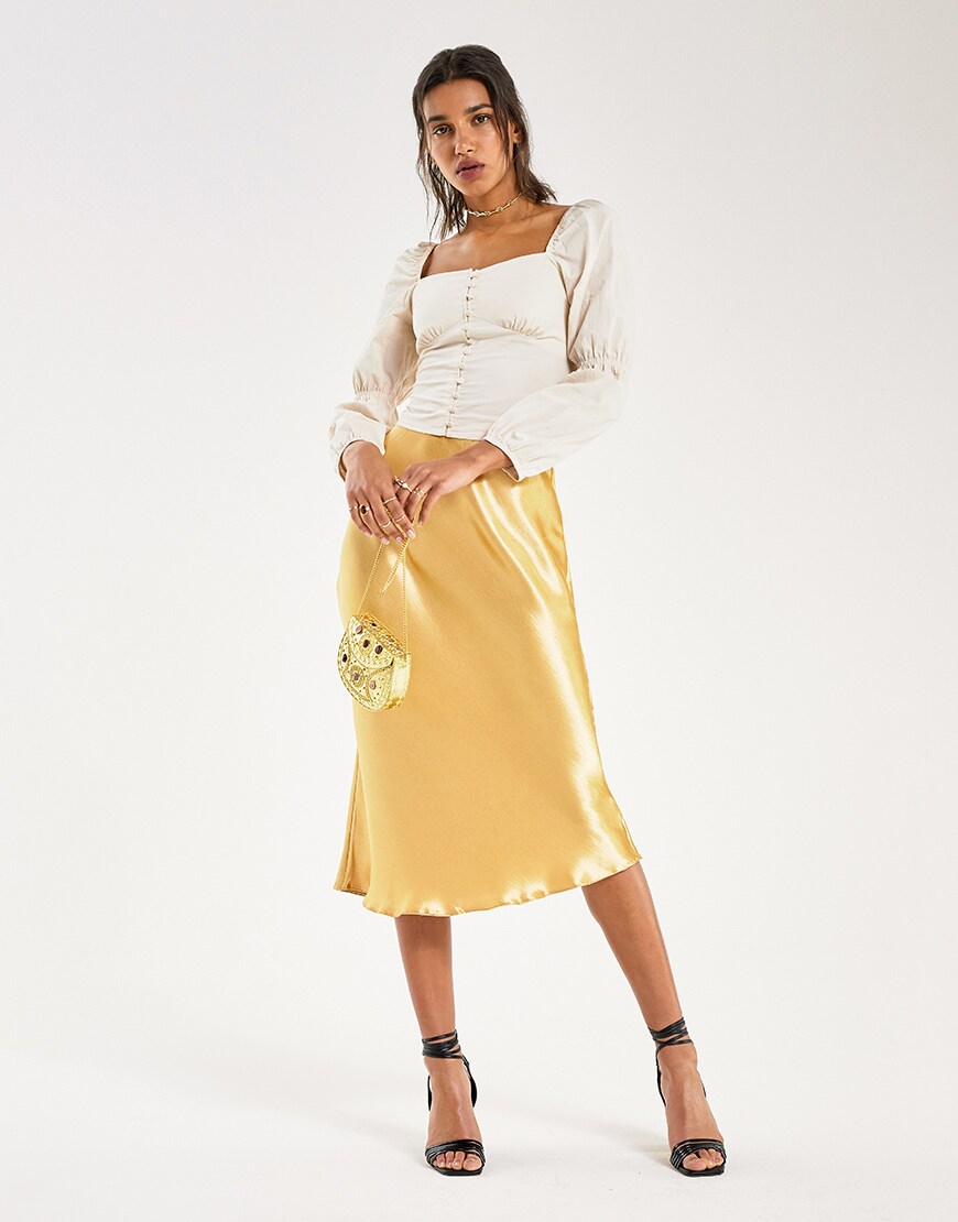 A model wearing a yellow skirt and peasant blouse | ASOS Style Feed