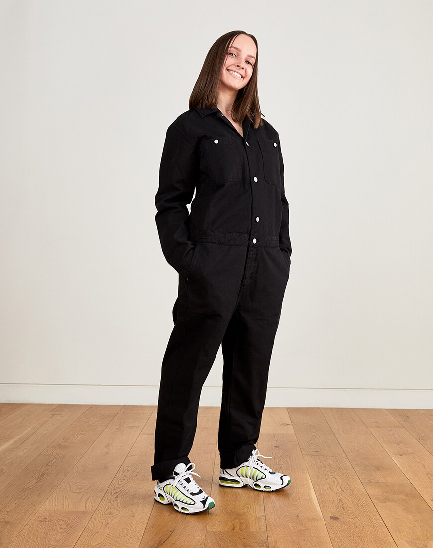 Titi Finlay in a black boilersuit | ASOS Style Feed