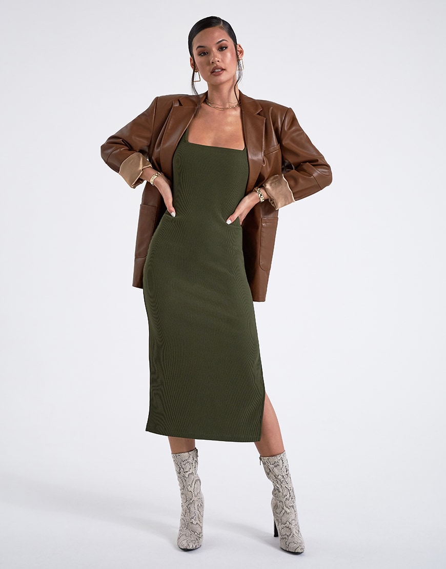 A model in a green dress and brown coat | ASOS Style Feed