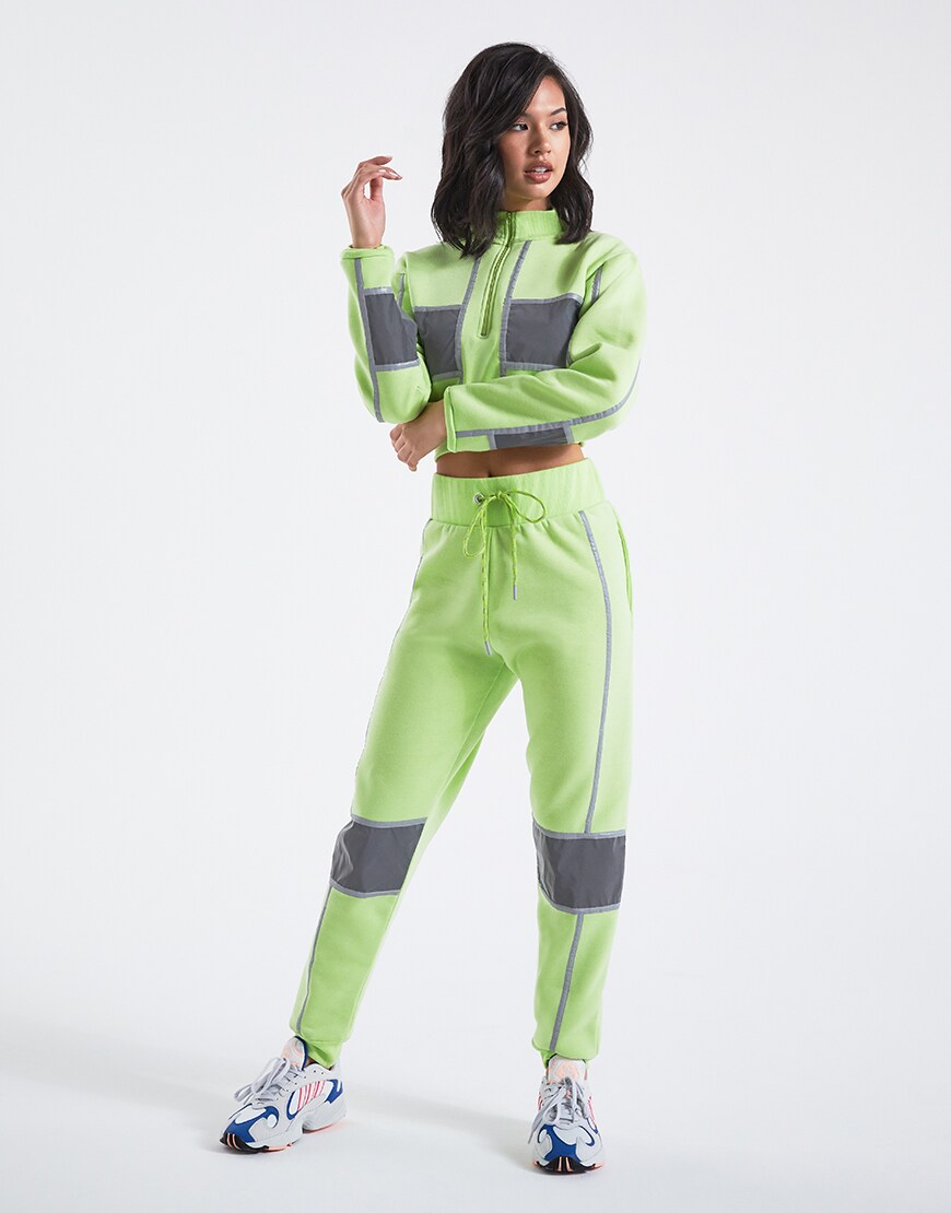 A model in a neon green tracksuit | ASOS Style Feed