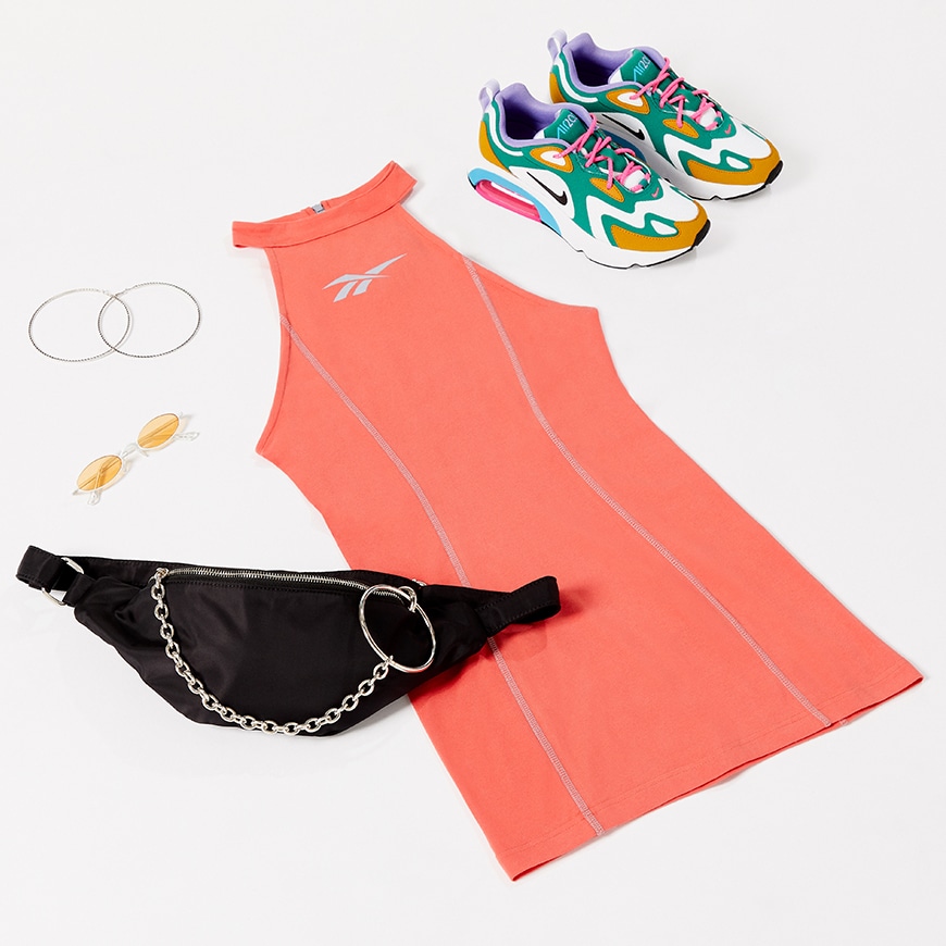 A flatlay image of an orange dress and trainers | ASOS Style Feed