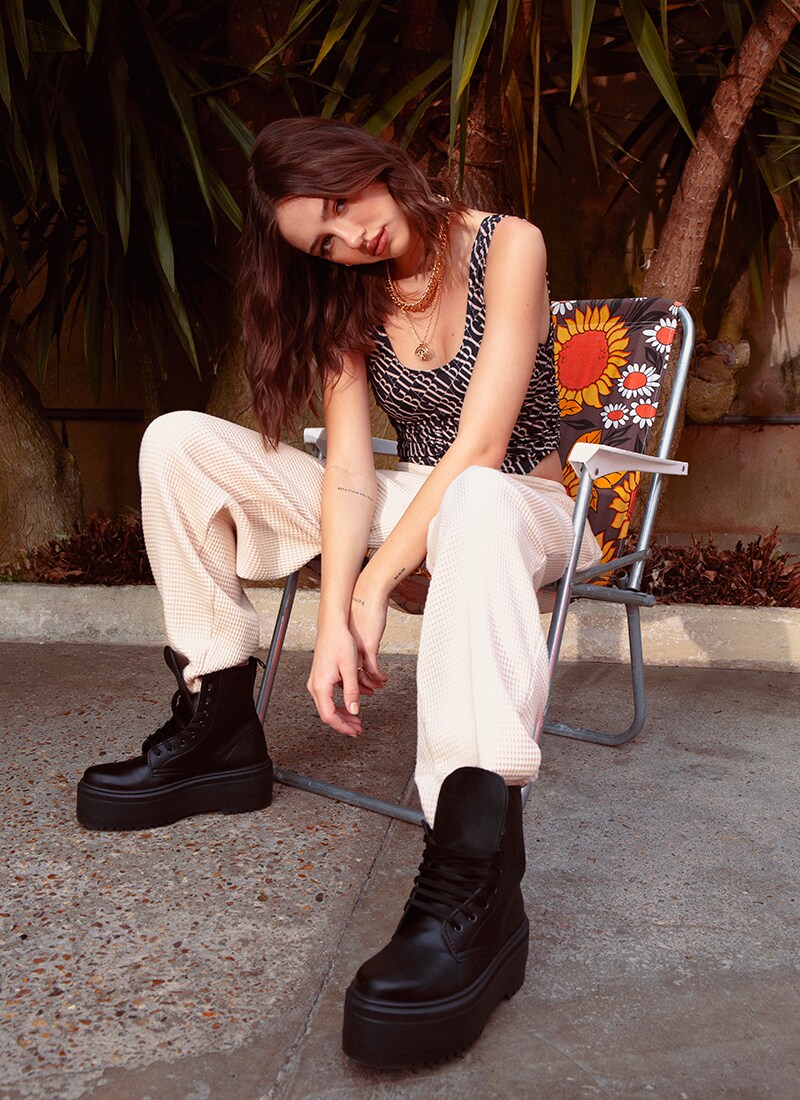 A picture of model Delilah Belle wearing a printed top and cargo trousers form her Style Edit. Available at ASOS.