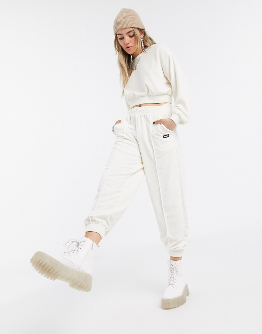 A picture of a model wearing a velour hoodie and sweatpants by Bershka. Available at ASOS