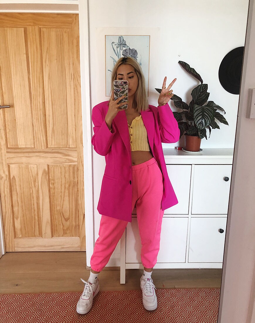 A woman wearing a blazer, crop top, joggers and trainers | ASOS Style Feedd