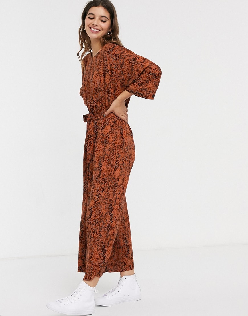 A picture of a model wearing a snakeskin jumpsuit. Available at ASOS.