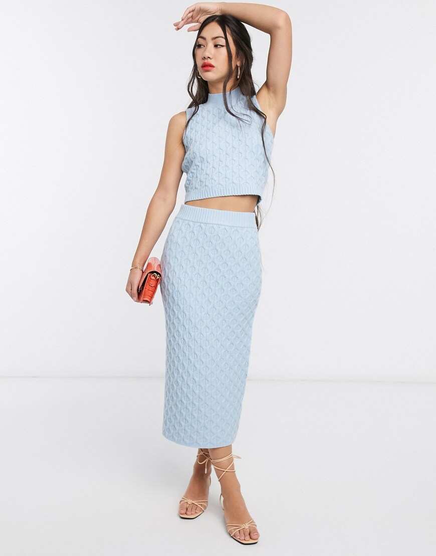 A picture of a model wearing a cable-knit midi skirt by Native Youth. Available at ASOS.