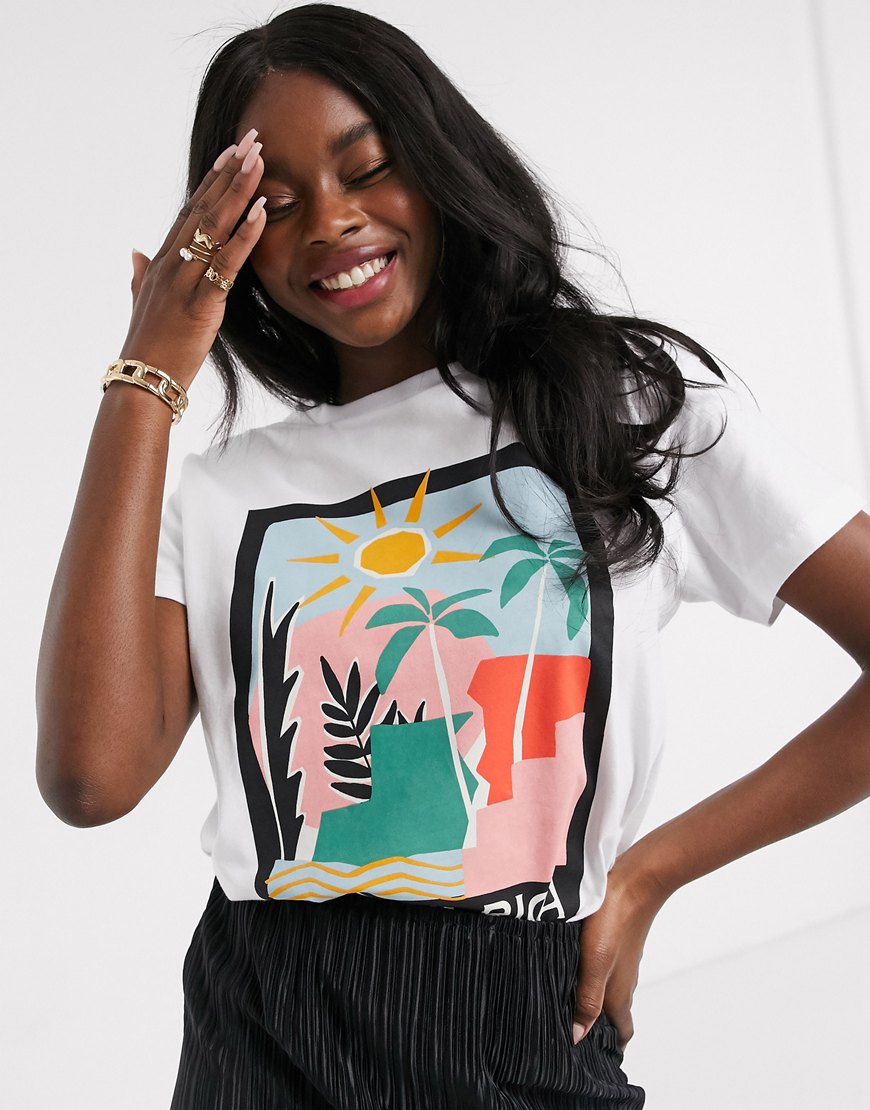 A picture of model wearing a printed T-shirt featuring a beach print from the ASOS Responsible edit. Available at ASOS.