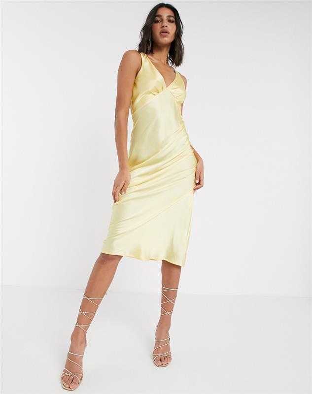 A picture of a woman wearing a lemon midi slip dress by ASOS DESIGN | ASOS STYLE FEED 