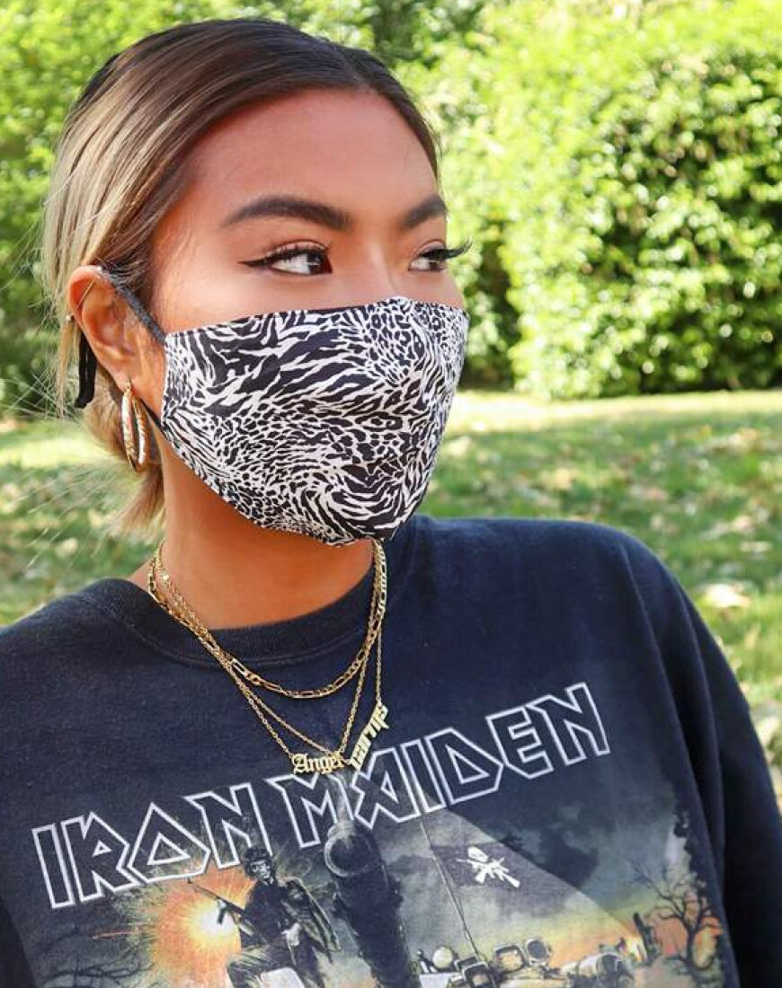 A woman wearing an ASOS DESIGN zebra-print face covering | ASOS Style Feed