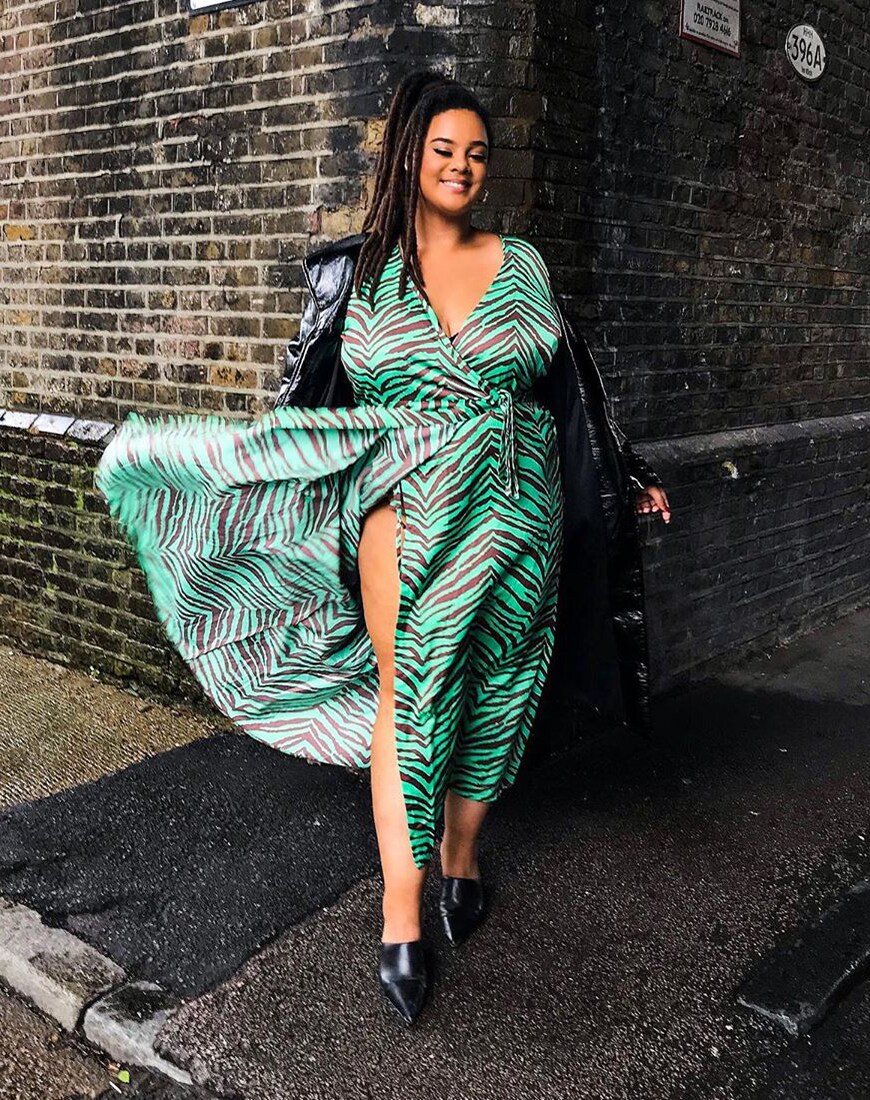 A picture of ASOS Insider ASOS Sophia wearing a green and black tiger stripe dress. 