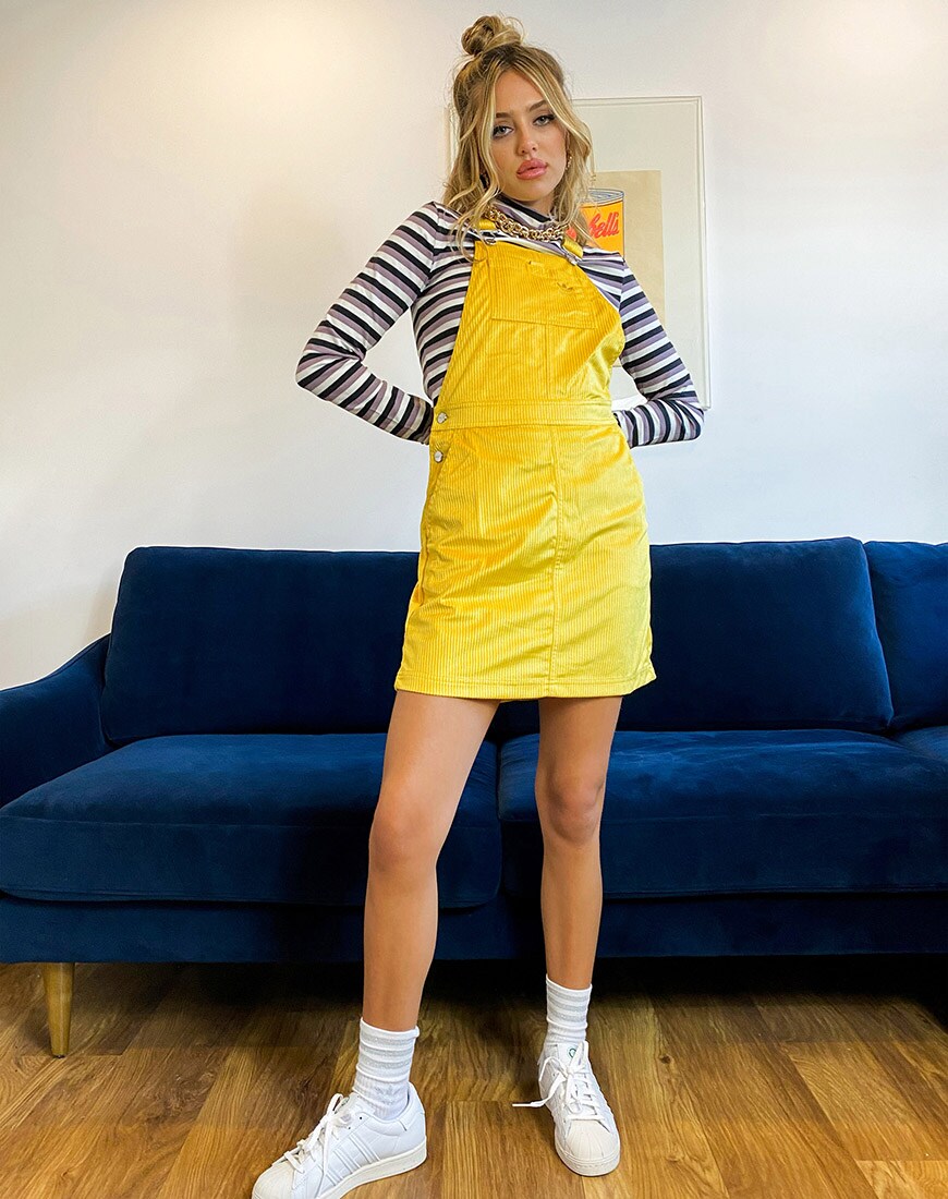 A picture of model and blogger Delilah Belle wearing a cord dress from the adidas Originals Comfy Cord collection. Available at ASOS | ASOS Style Feed