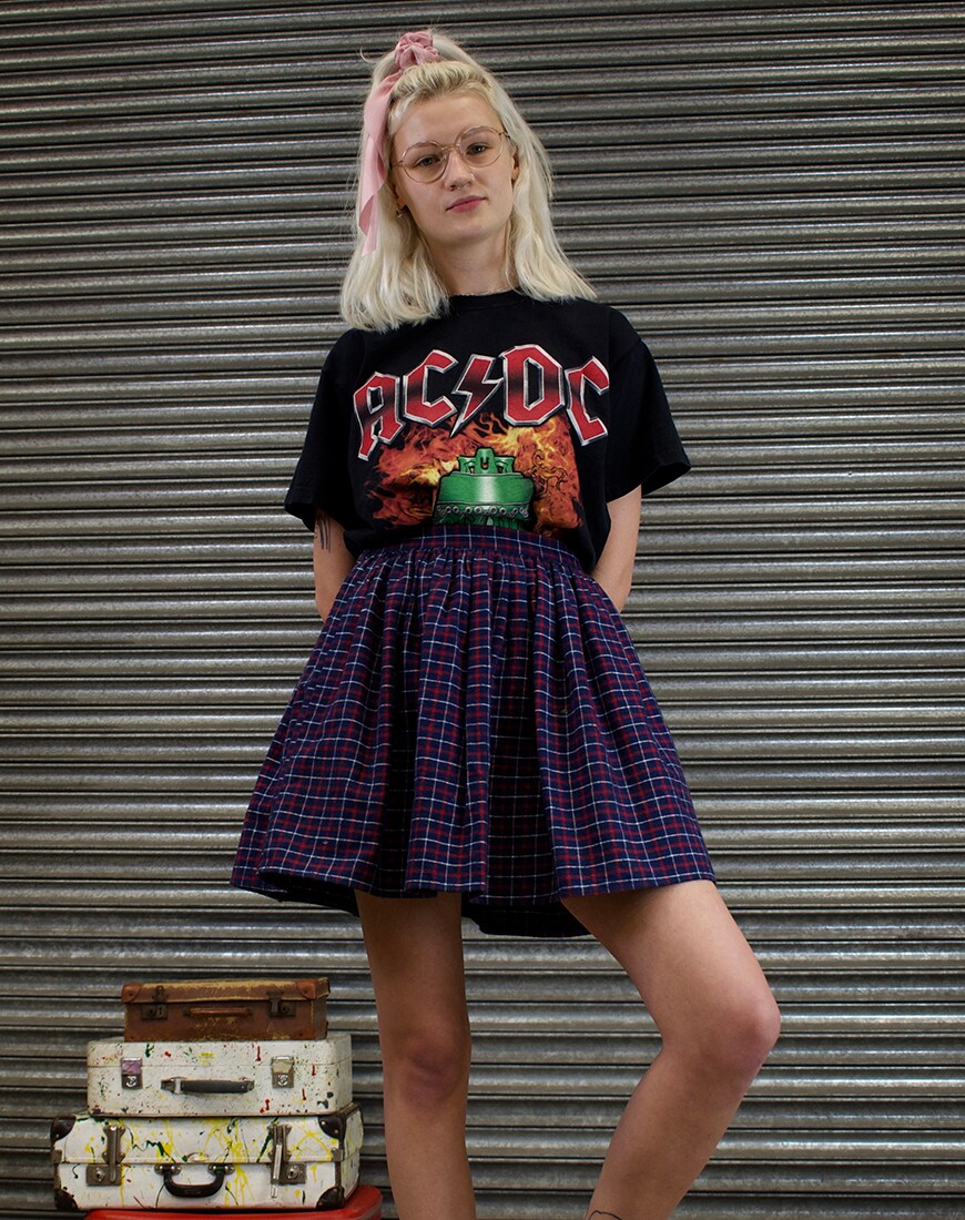 A picture of a model wearing a band tee and plaid skirt.  Available at ASOS Marketplace |ASOS Style Feed