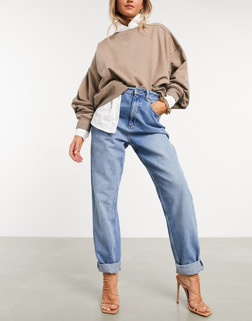 A picture of a model wearing a pair of mom jeans.  Available at ASOS |ASOS Style Feed