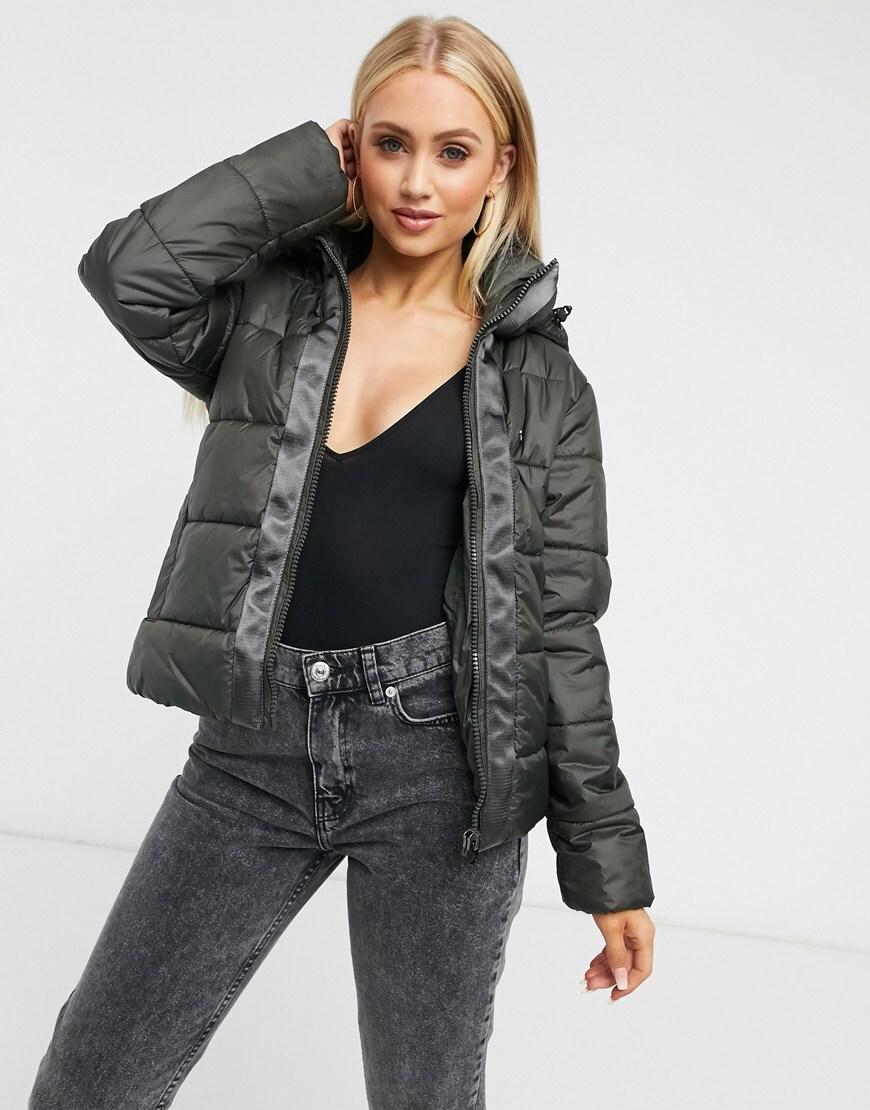 A picture of a model wearing a khaki padded coat. Available at ASOS |ASOS Style Feed