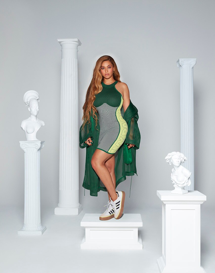 A picture of Beyoncé wearing a bodycon dress and a green mac from the new Ivy Park x adidas Drip 2 collection | ASOS Style Feed