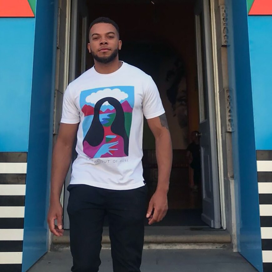Nic standing in front of a colourful building | ASOS Style Feed