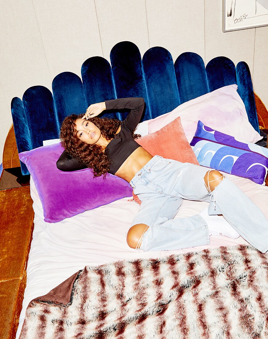Leigh-Anne Pinnock in ASOS DESIGN while lounging on a bed | ASOS Style Feed