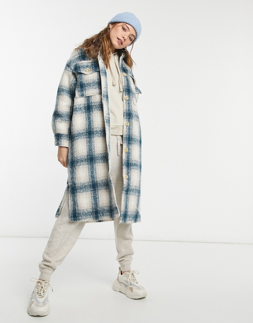 Model wearing Pull&Bear long overshirt shacket in blue and tan plaid