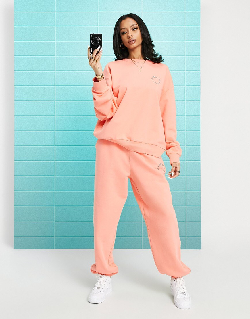 An image of a woman wearing a pink tracksuit by ASOS Design | ASOS Style Feed