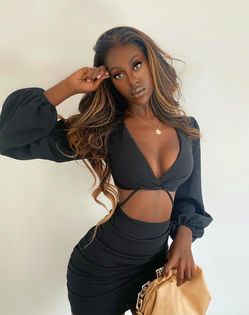 Model wearing ASOS DESIGN cut out strappy shirt mini dress with ruching in black