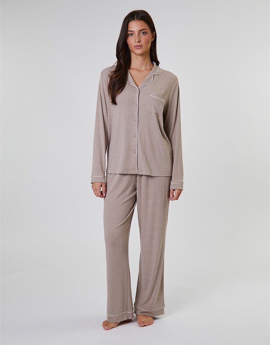 Woman wearing a beige pyjama set