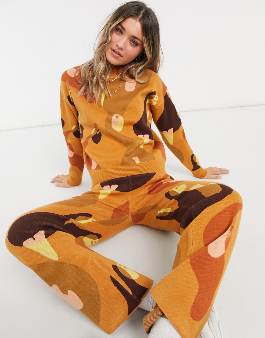 Model wearing Never Fully Dressed knit sweater and pants set in mixed abstract print