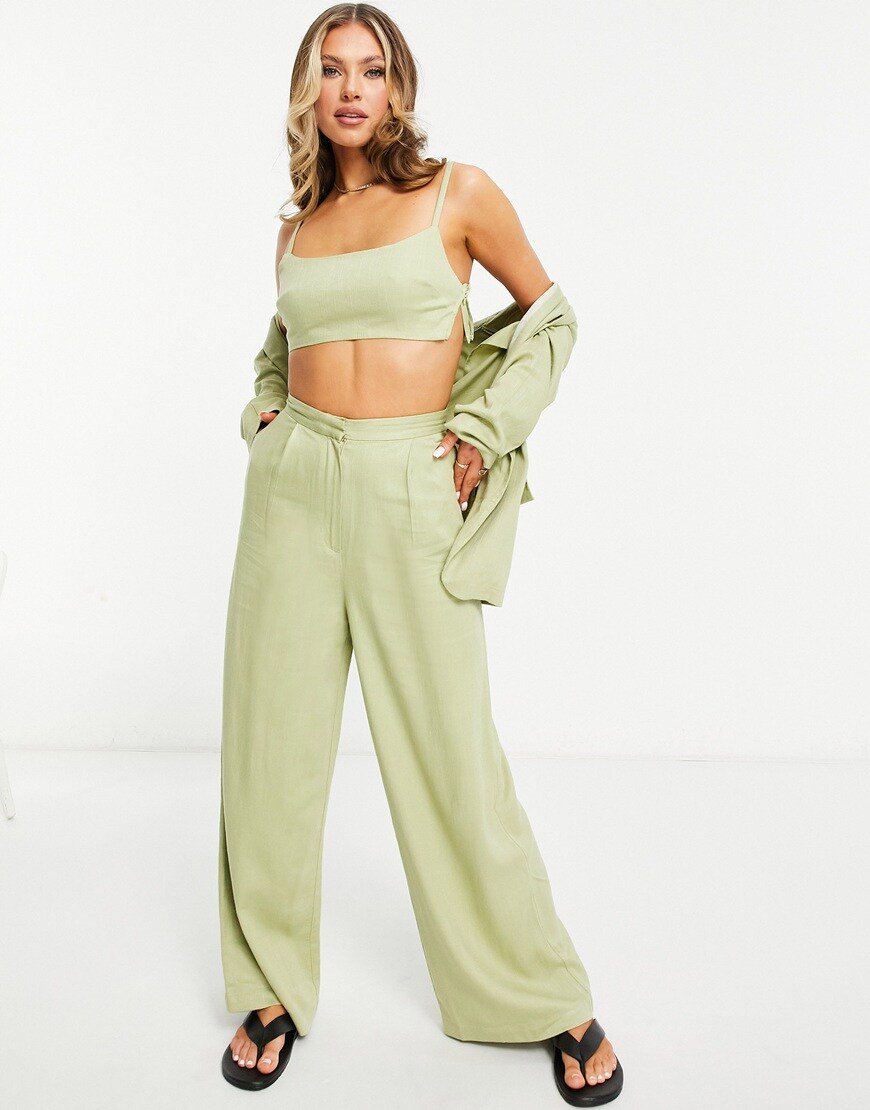 An image of a woman wearing a green suit by ASOS Design | ASOS Style Feed
