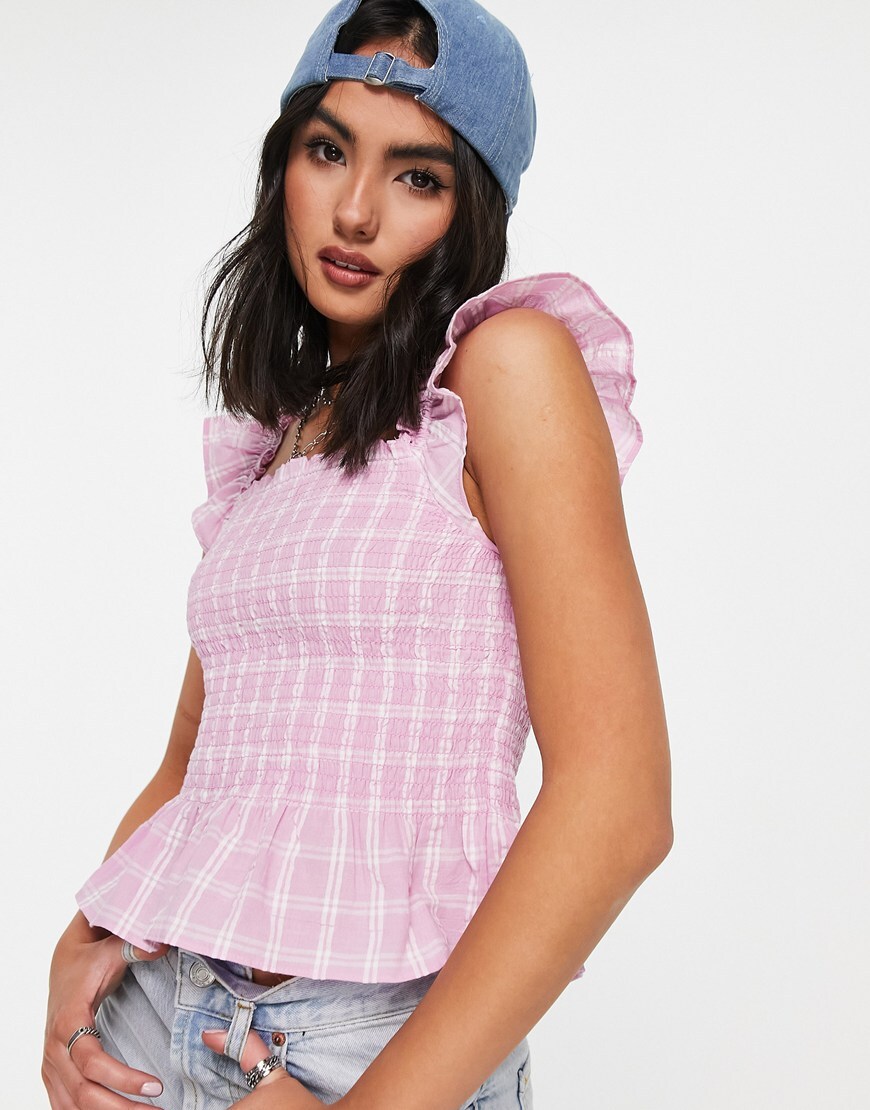An image of a woman wearing a pink top by Monki | ASOS Style Feed