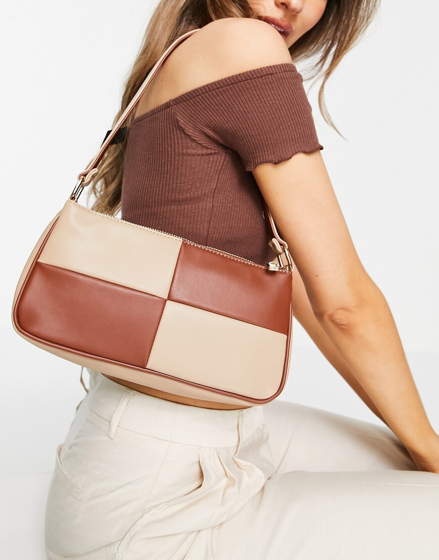 An image of a woman wearing a brown bag by ASOS Design | ASOS Style Feed