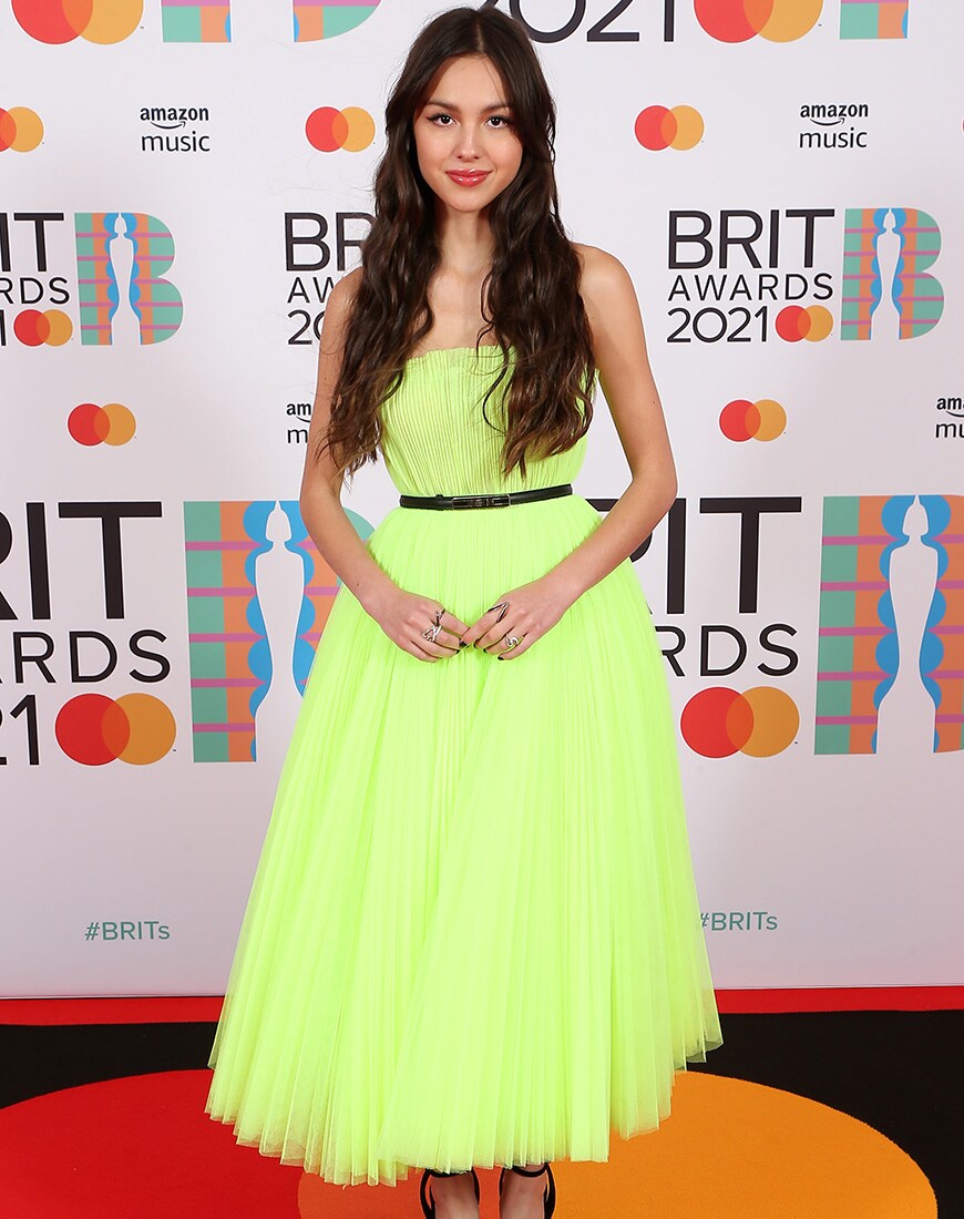 Olivia Rodrigo wears a yellow Dior gown at the Brits