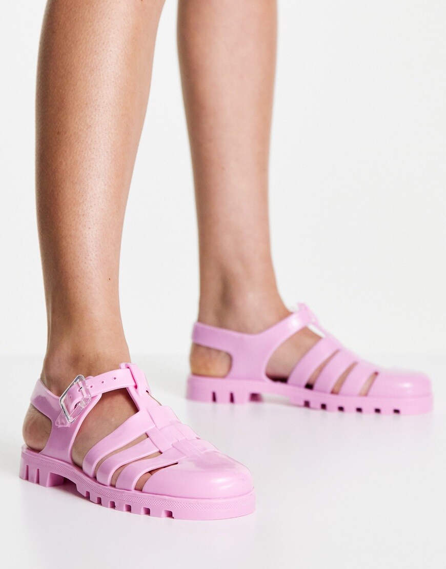 An image of a pair of pink jelly shoes by Juju | ASOS Style Feed