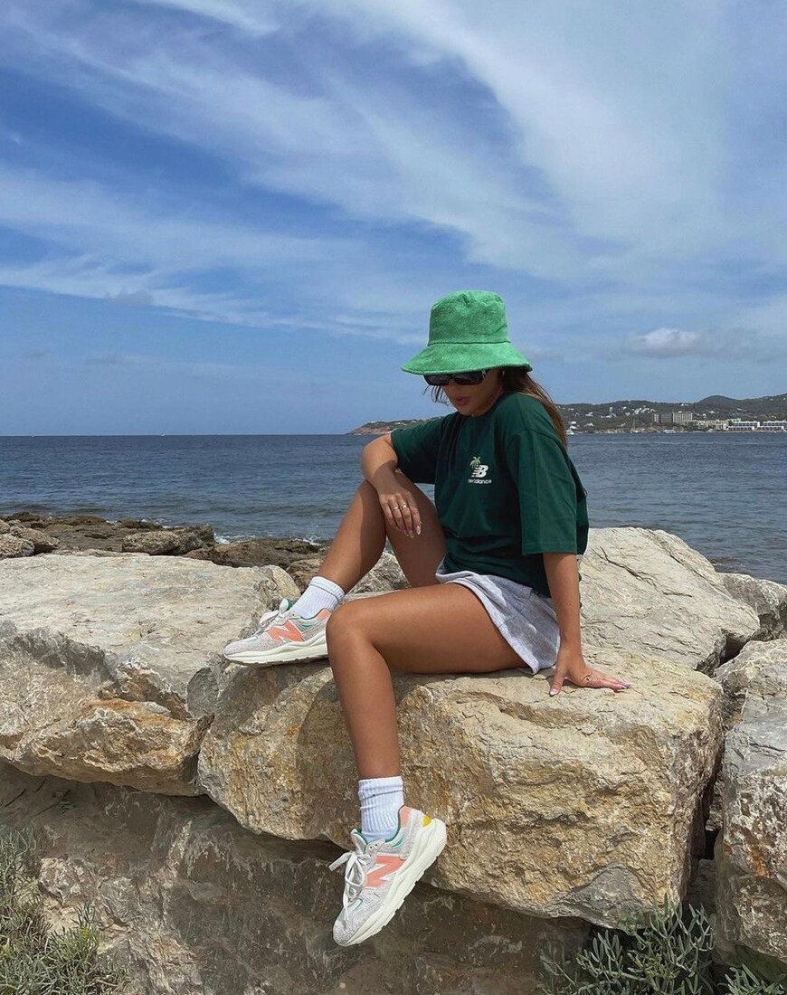 A woman wearing a New Balance T-shirt and trainers | ASOS Style Feed