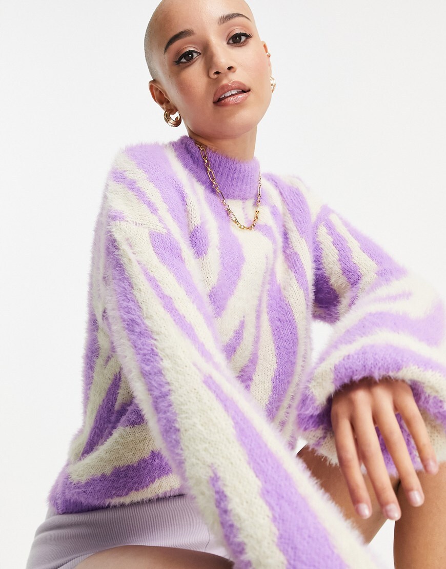 Model wears a furry zebra-print high neck cropped knit. The jumper is bright purple and white. | ASOS Style Feed