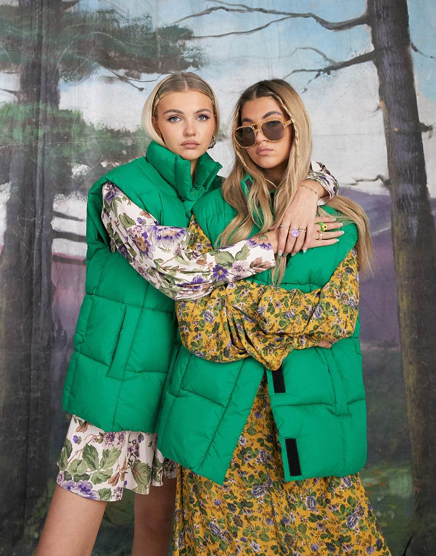 An image of two women wearing a green gilet by ASOS Design | ASOS Style Feed