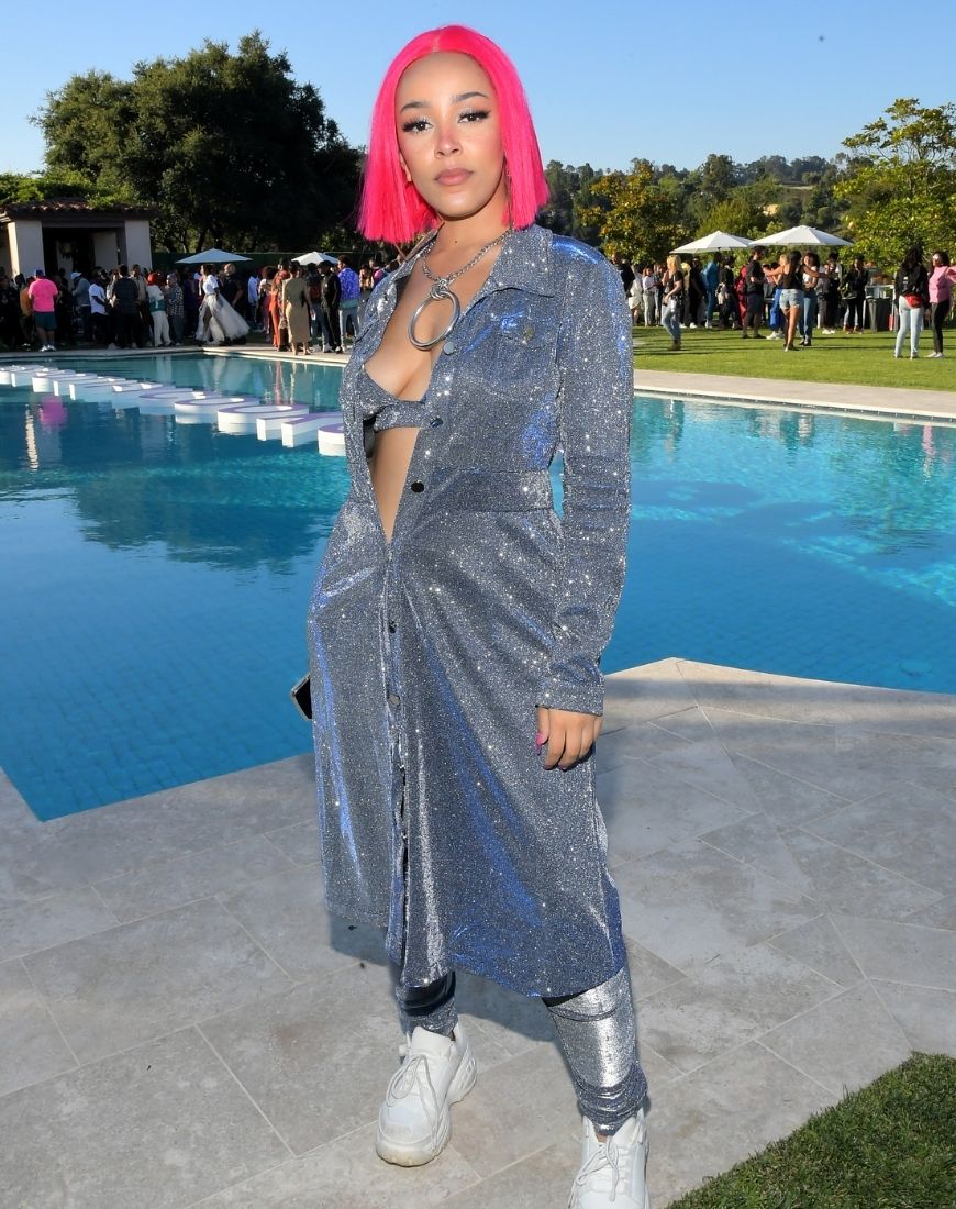 Doja Cat wears a glittering long grey coat with matching trousers. | ASOS Style Feed