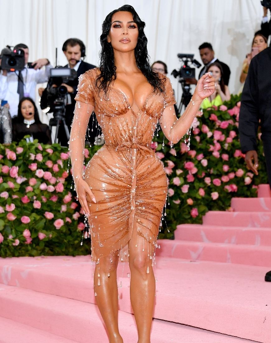 Kim Kardashian wears a tight nude wet look dress that is dripping in crystals. | ASOS Style Feed