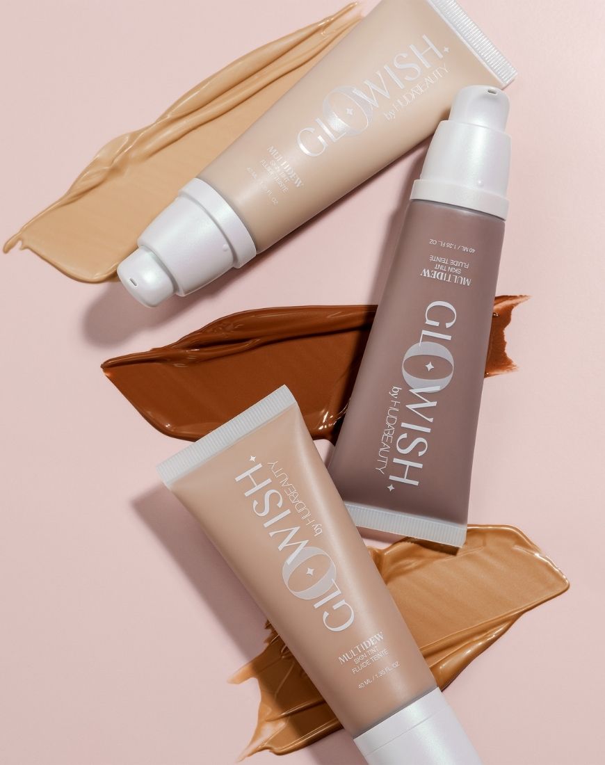 An image of three different shades of the Huda Beauty GloWish Multidew Skin Tints. | ASOS Style Feed