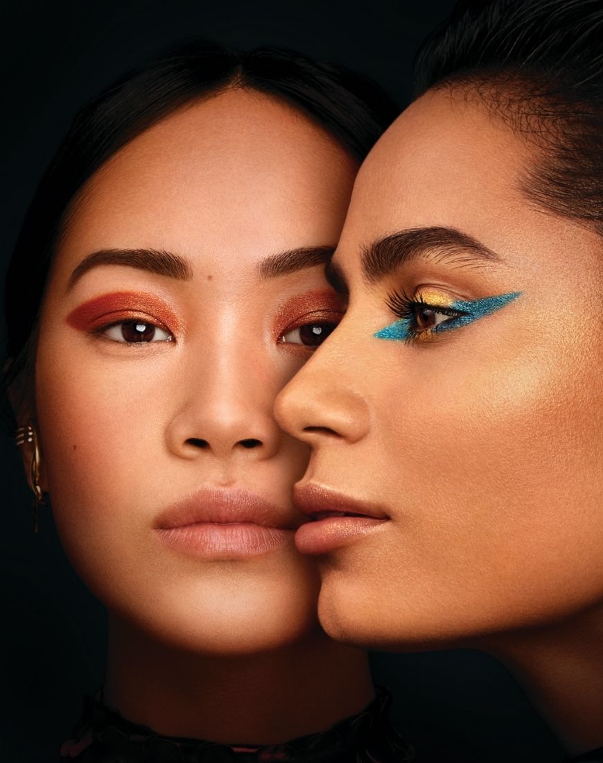 Two models are wearing different looks created using the Urban Decay x Marvel Studio's Eternals collection. One is wearing a bronzed eye and the other a gold and blue combo. | ASOS Style Feed